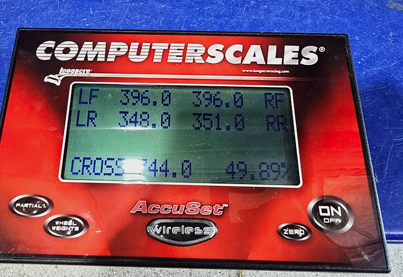 A Longacre AccuSet corner-weight readout showing each wheel weight and the cross weight at 49.89 per cent