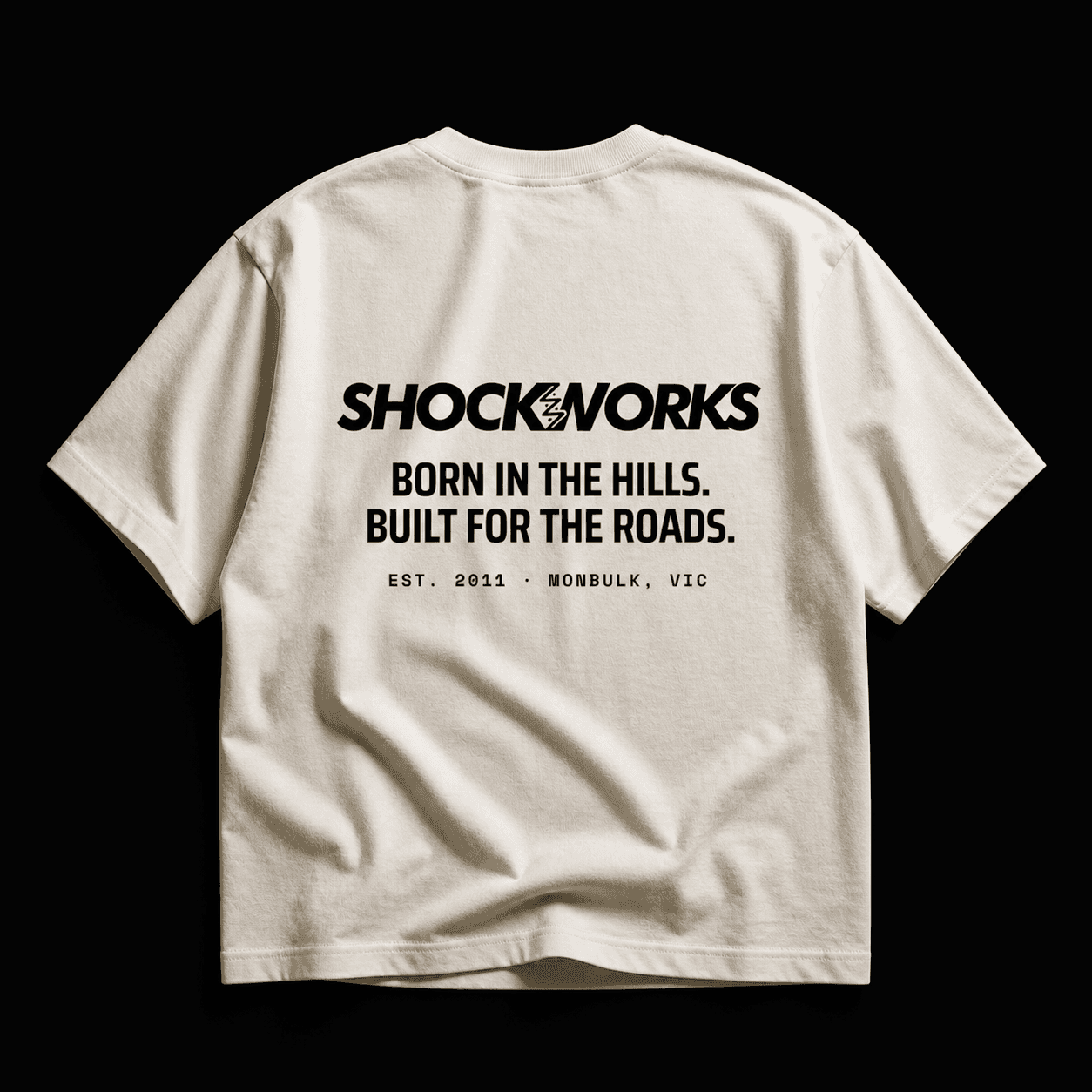 Back of a bone Shockworks Hills tee with a black print