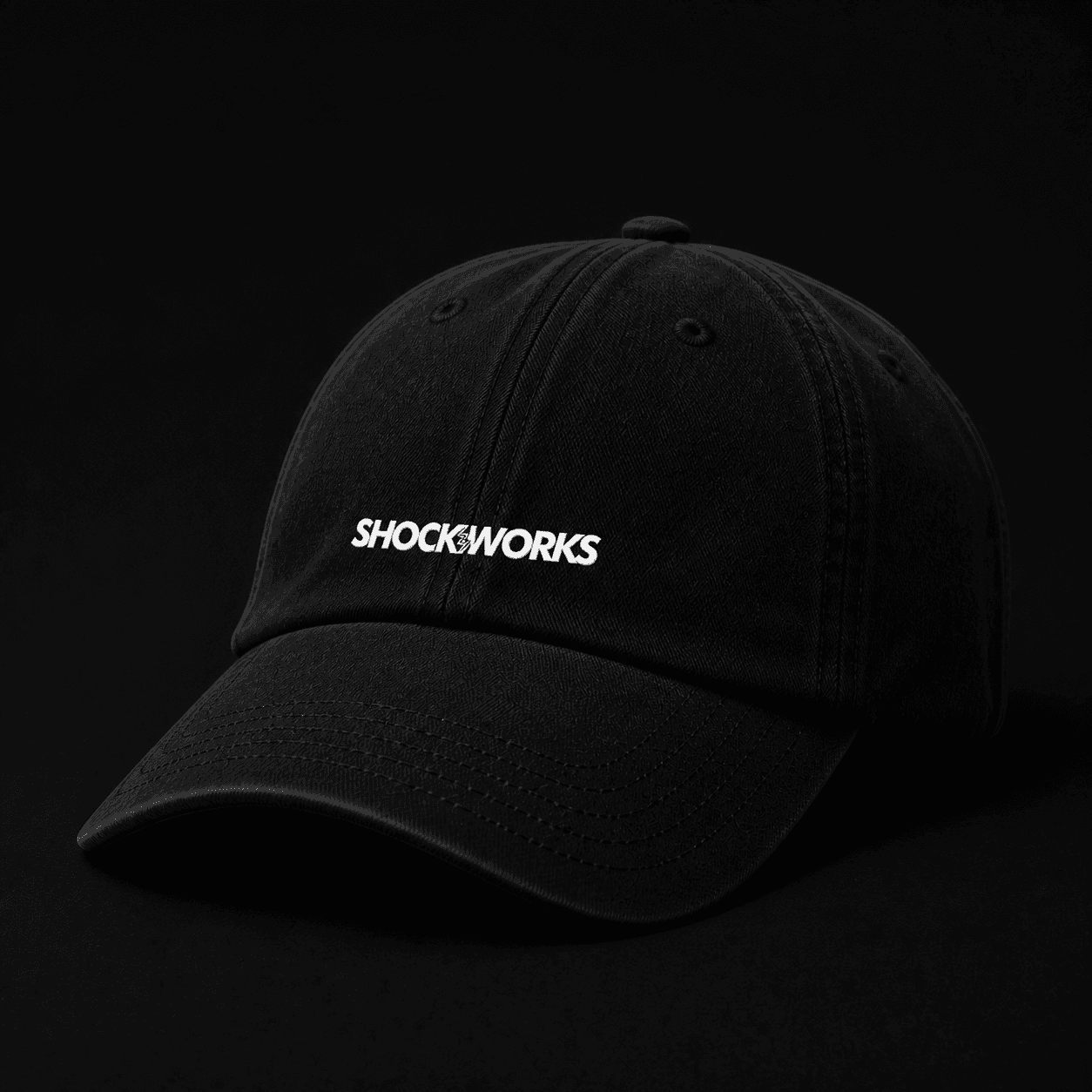 Black curved-brim cap embroidered with the Shockworks wordmark