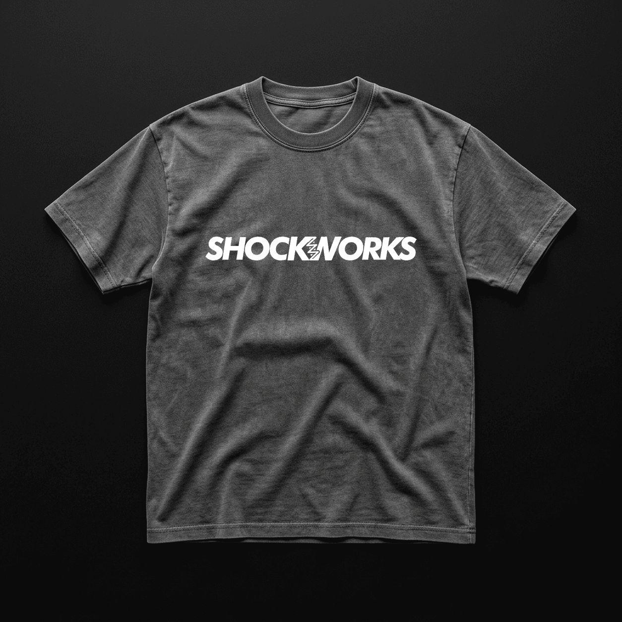 Washed charcoal tee with a white Shockworks wordmark
