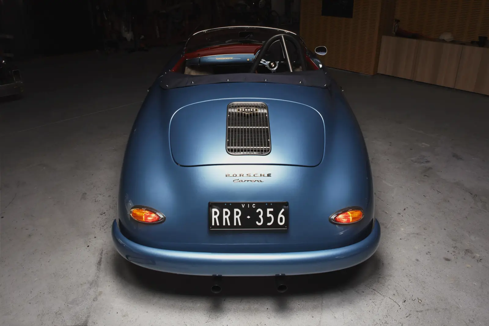 Renner's blue 356 Carrera rear-on in the workshop, built in Melbourne on Shockworks suspension